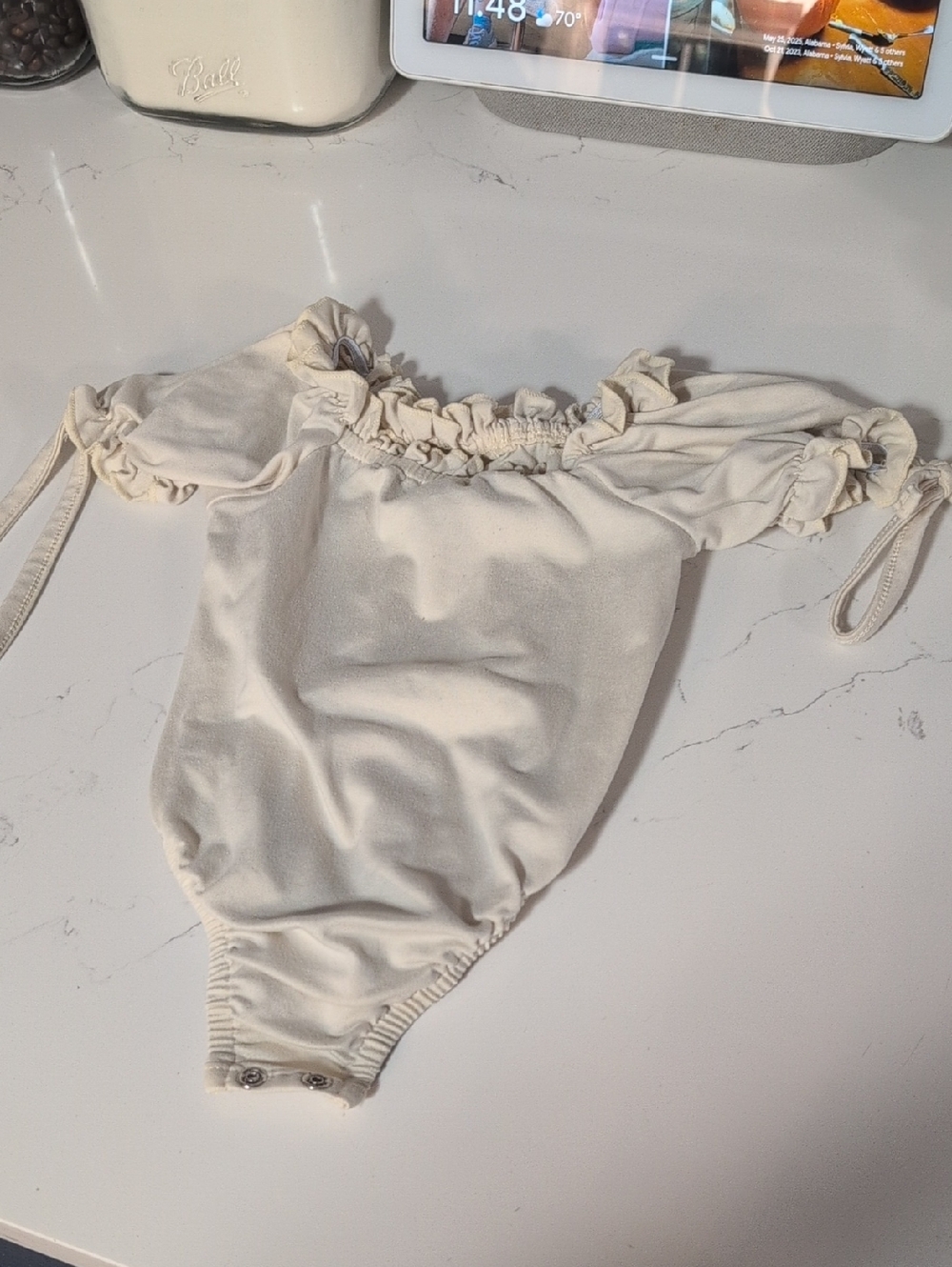 Cream Ruffled Off-Shoulder Baby One-Piece Bodysuit